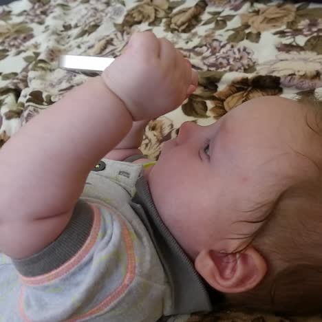 baby boy with smartphone