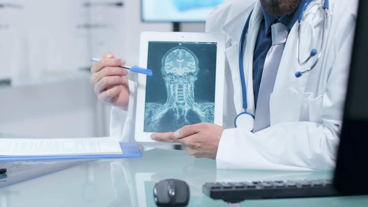 Doctor examining medical scan on tablet