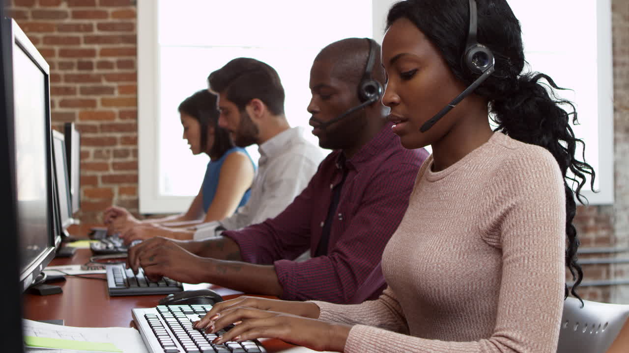 Staff At Desks In Customer Service Department Shot On R3D