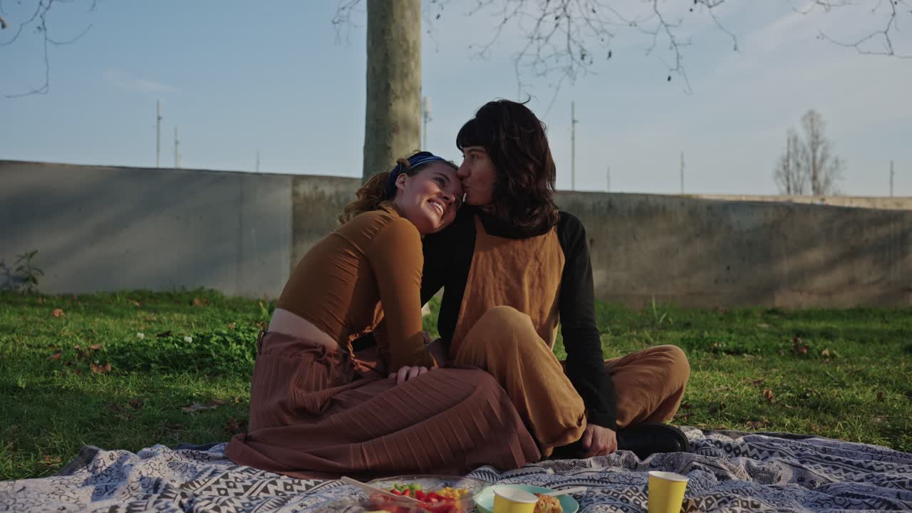 Two Women Enjoying a Picnic Together