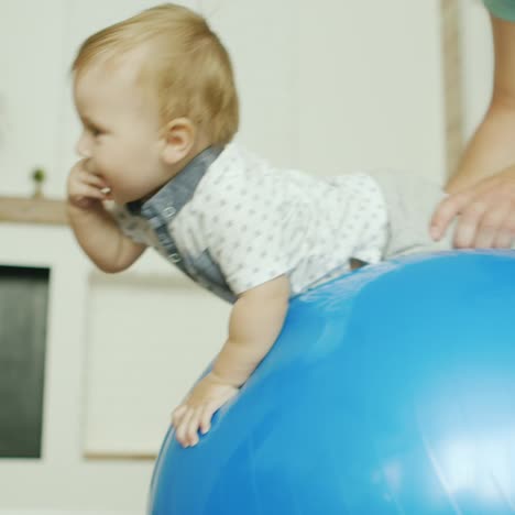 the little boy is having fun at home - dad is playing with him