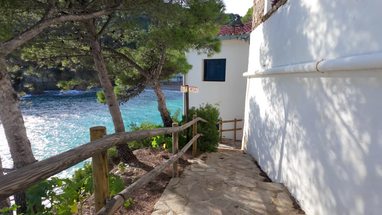 Tamariu Beach in Costa Brava de Girona super slow motion white houses in front of the Mediterranean Sea