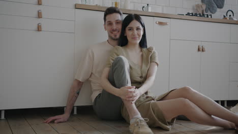 couple sitting in a modern kitchen