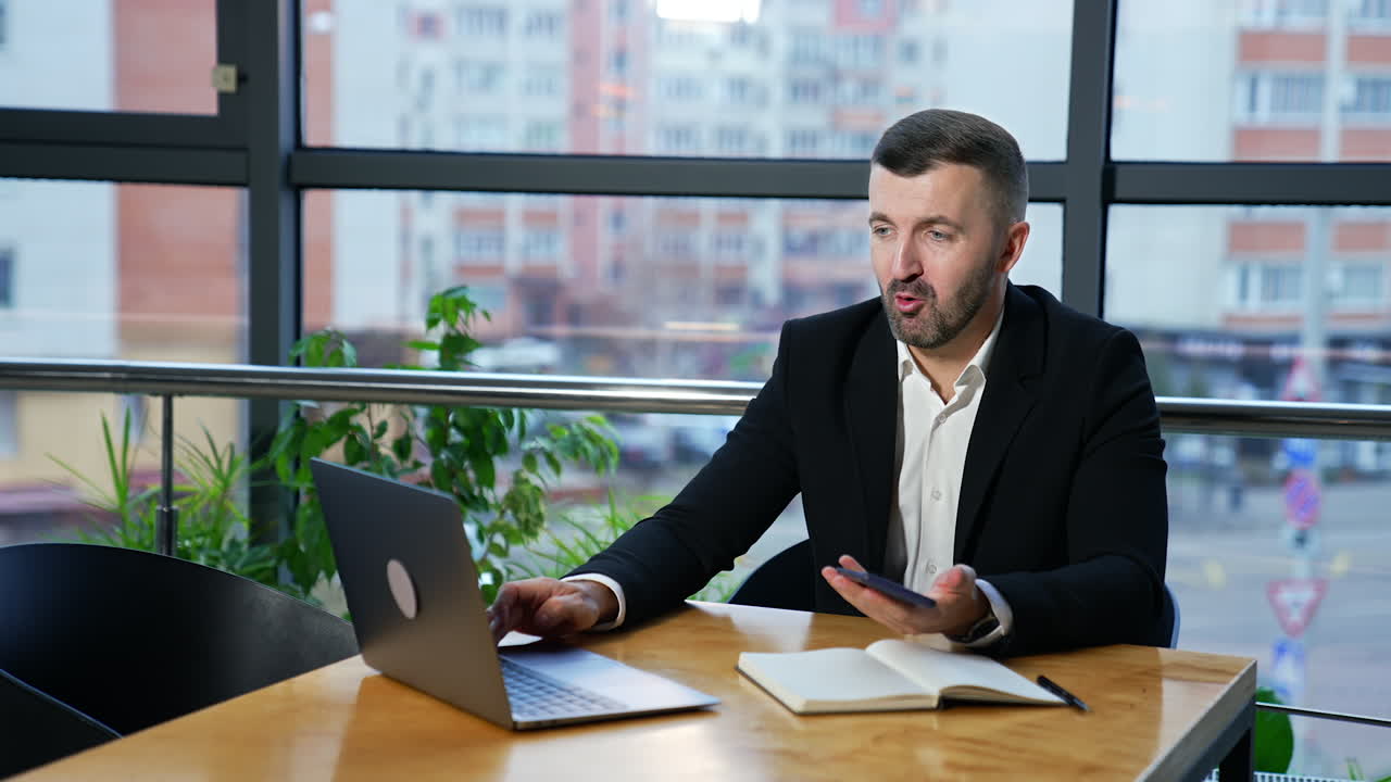 Businessman successful working with laptop in modern office. Handsome man notebook work.