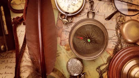 vintage style travel and adventure. vintage old compass and other vintage items on the table.