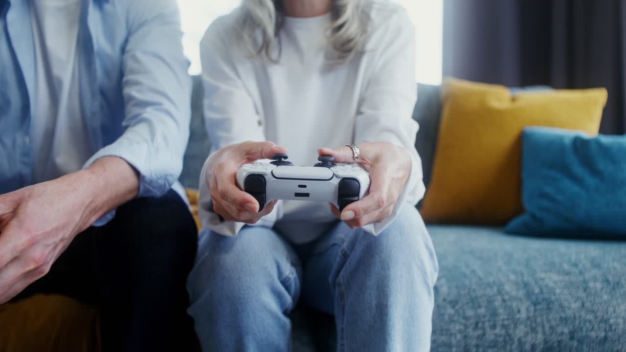 Mature Couple Playing Video Games at Home