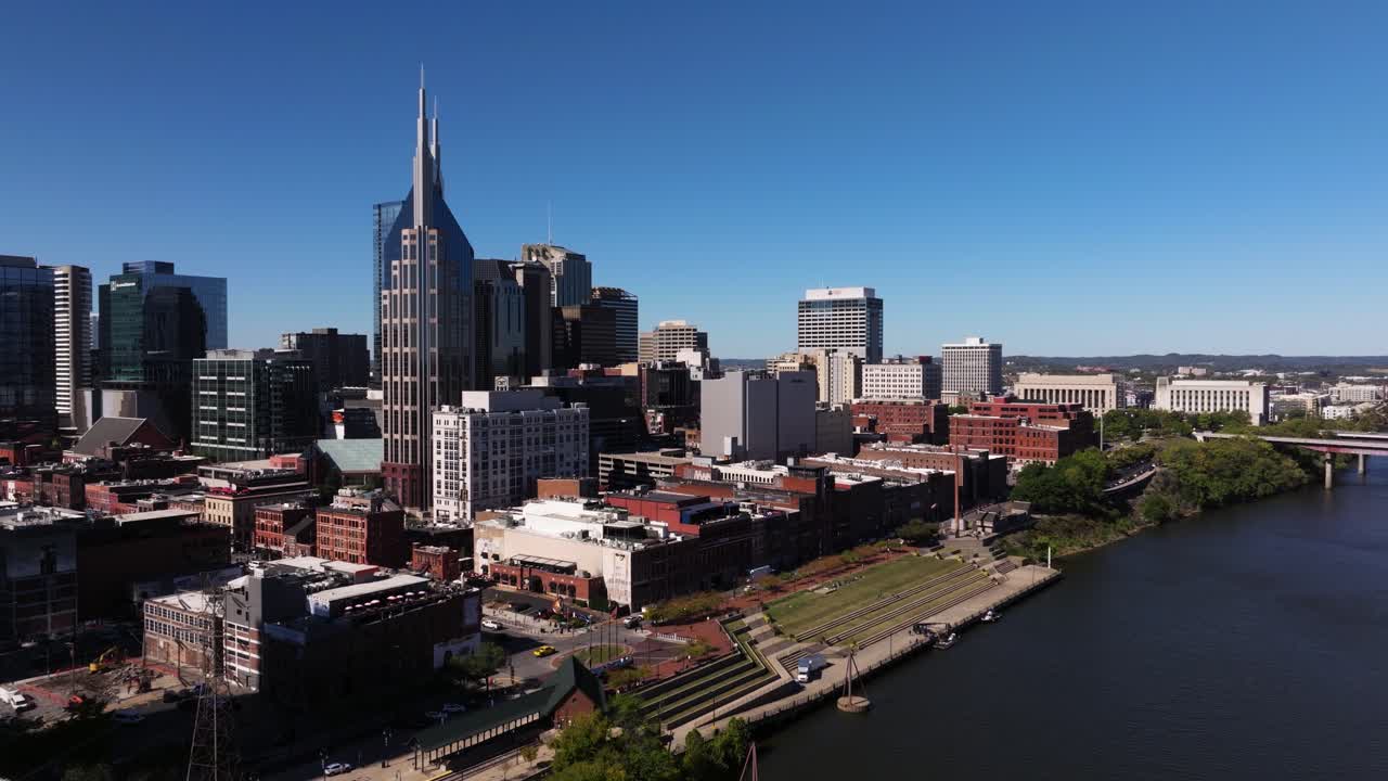 Cinematic Drone Shot Above Pedestrian Bridge Cumberland River. Nashville Skyline
