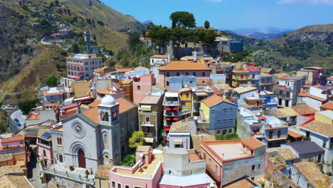 aerial shot of the beautiful a village built around the hill