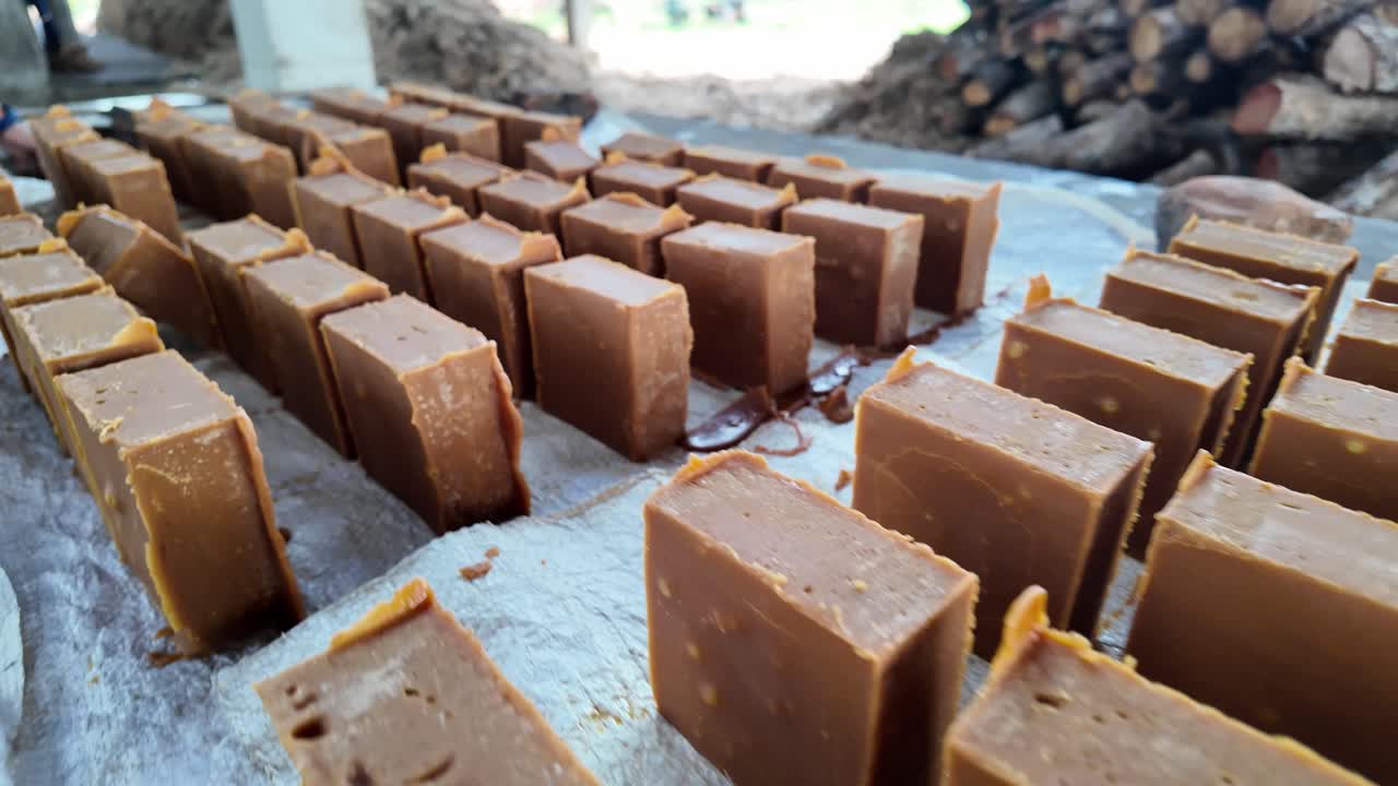 Freshly cut blocks of traditional Venezuelan brown sugar on drying surface