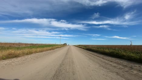 point of view footage while driving down a gravel road in rural iowa