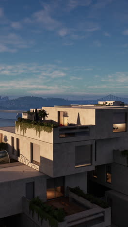 modern concrete apartment building with city skyline view at sunset