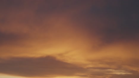 a serene sky at dusk with golden clouds creating a tranquil and dreamy atmosphere