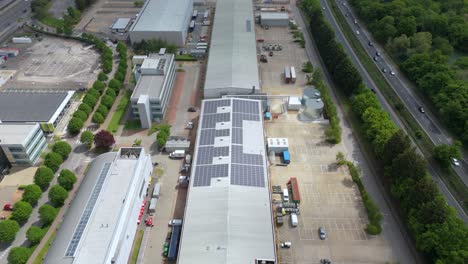 overhead drone view of factory units and business park in uk with transport networks