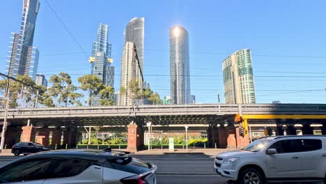 cars moving under a bridge in melbourne