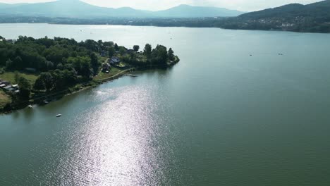 Landscape-of-majestic-Zywiec-lake-in-Beskid-mountains---aerial-view-of-shoreline-in-4K