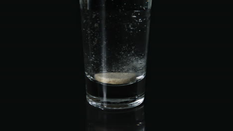 effervescent tablet in glass of water