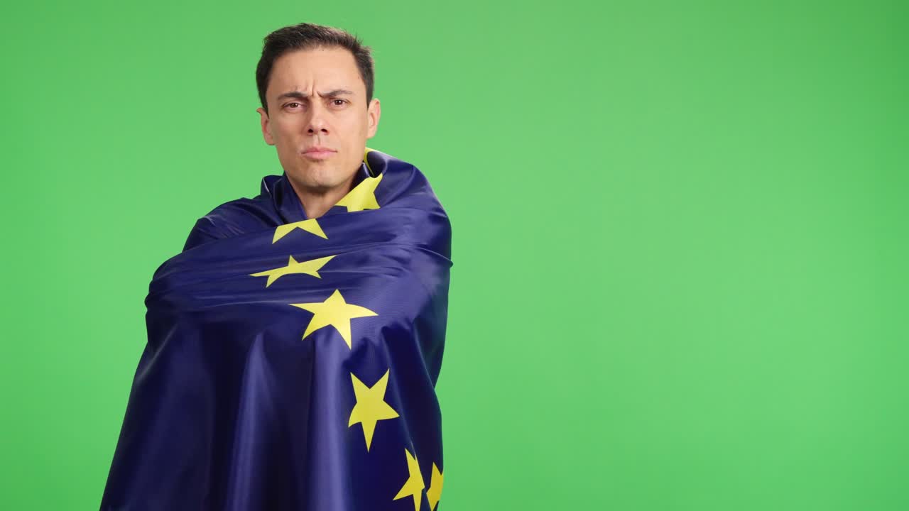 Proud european man wrapped in european union flag on green screen