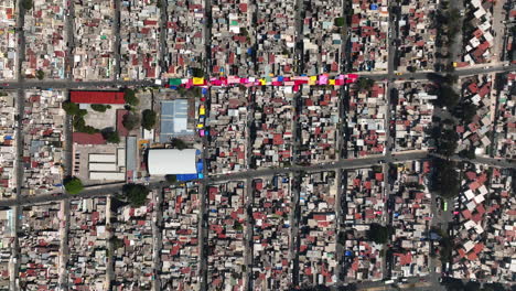 aerial view above a ghetto, in sunny iztapalapa, mexico - top down, drone shot