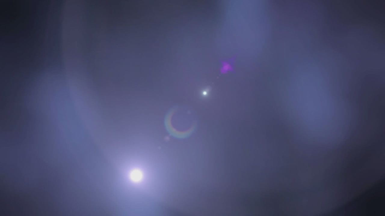 Animation of light moving around on dark blue background