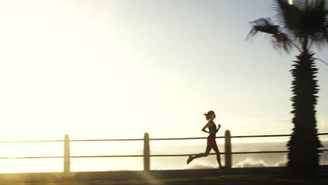 mixed race woman runner running on road