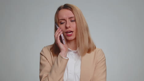 tired sleepy disinterested business woman having annoyed boring talk on smartphone, conversation