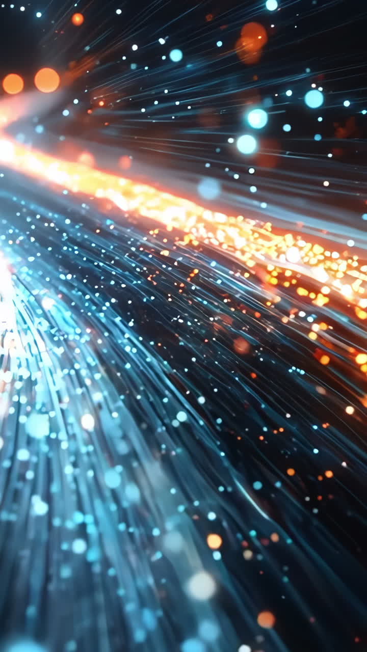 A bright orange and blue line of light is shown in the image. The line of light is moving and he is a part of a larger, more complex pattern. The colors of the light are vibrant and dynamic