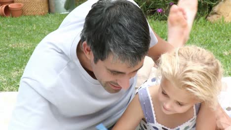 father with his daughter in the garden