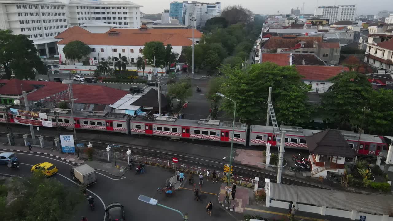 Aerial footage, dense atmosphere of Malioboro street Yogyakarta, visible railway tracks of Tugu station. Main destination in Yogyakarta.