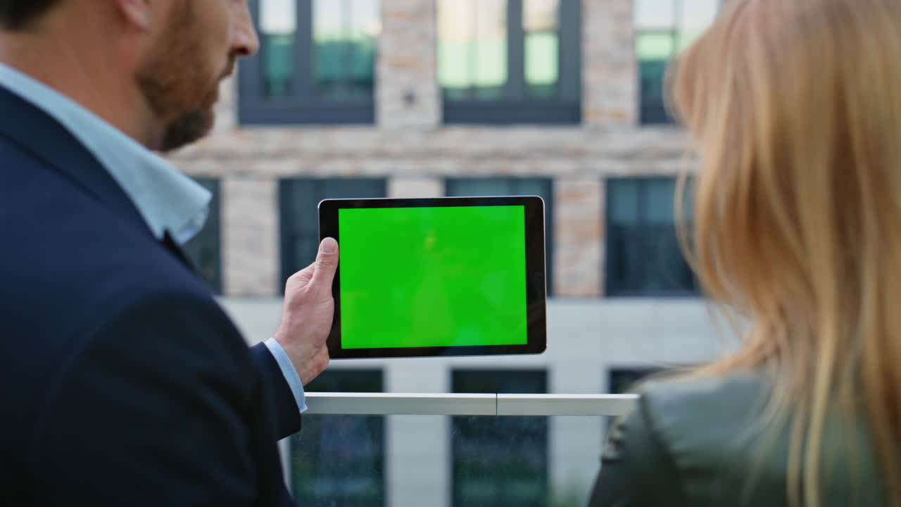 Business team using tablet chroma key researching web network at street closeup