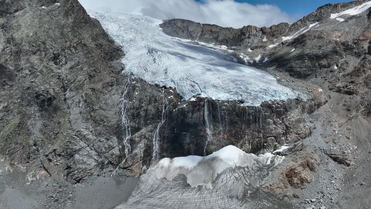 Aerial Backward Far Drone Shot of Fellaria's Glacier and its Waterfalls - Valmalenco - Sondrio