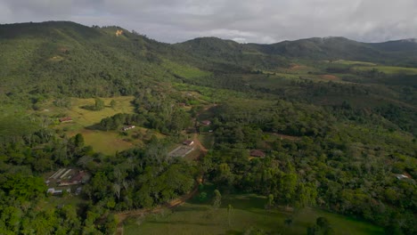 jib down with drone above fields in colombia at a cloudy day