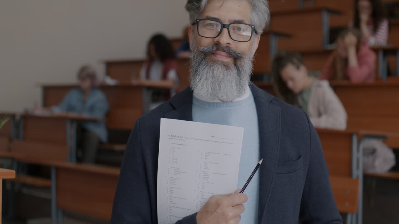 Professor holding exam in classroom