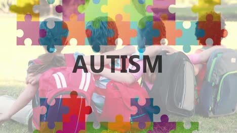 Animation-Des-Textes-Zum-Autismus-Bewusstseinsmonat-über-Einem-Puzzle-Und-Sich-Umarmenden-Schulkindern