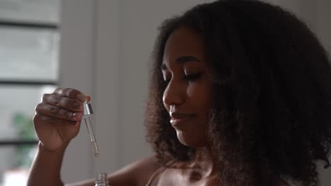 woman applying serum