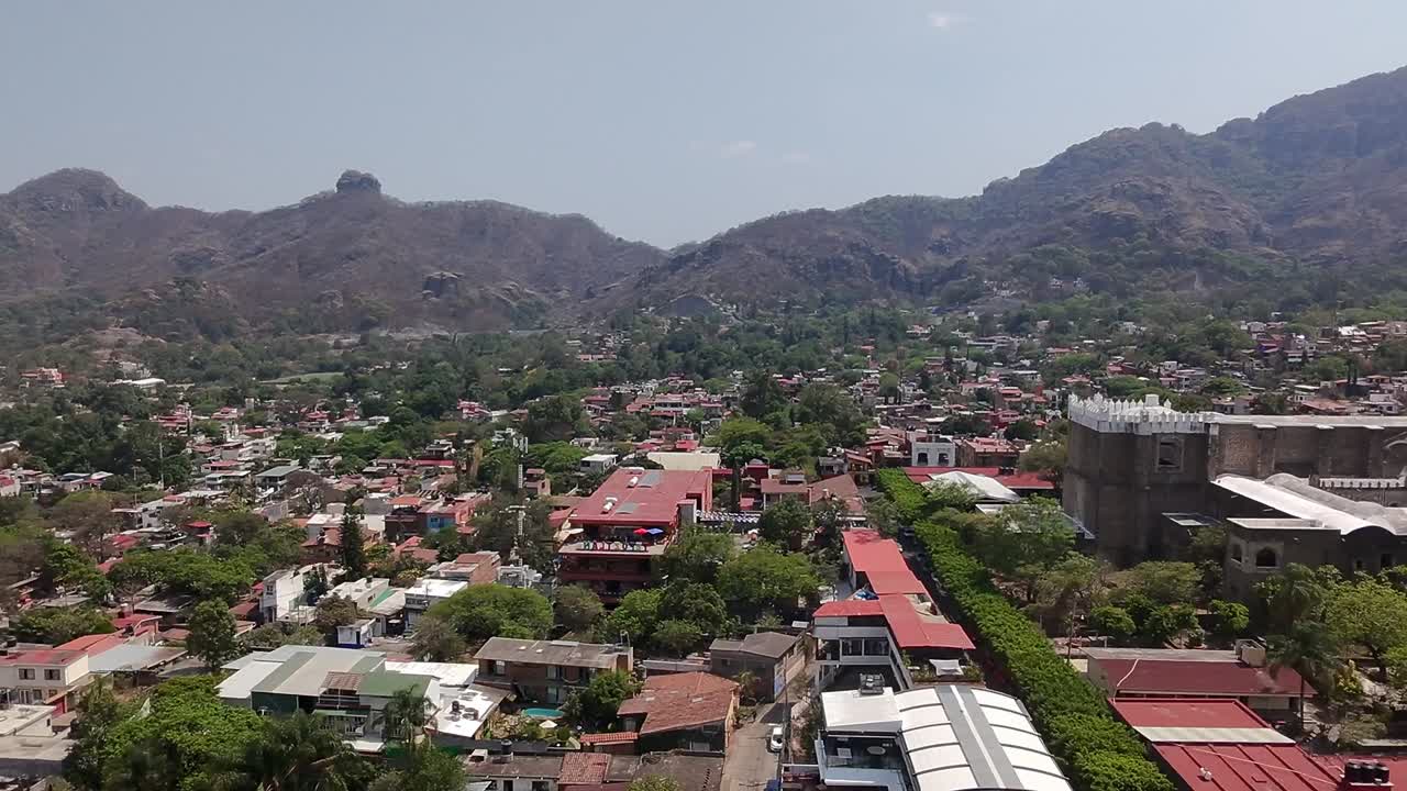 Aerial footage of Tepoztlán, Mexico, on a clear, sunny day