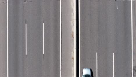 aerial view of empty highway with cars driving