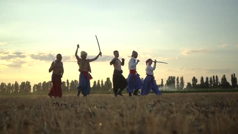 group of cossack men in traditional clothes swinging and spinning sharp shashkas 03