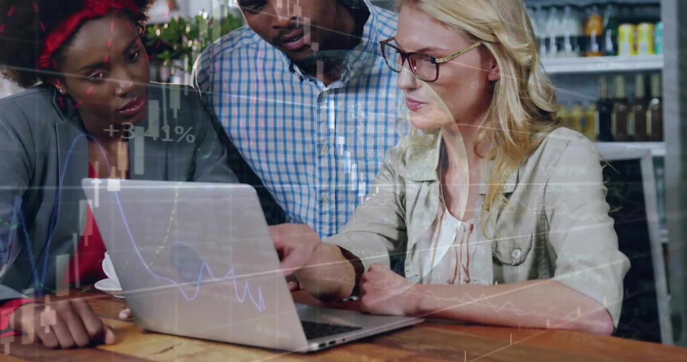 Diverse Business Team Analyzing Financial Data on Laptop