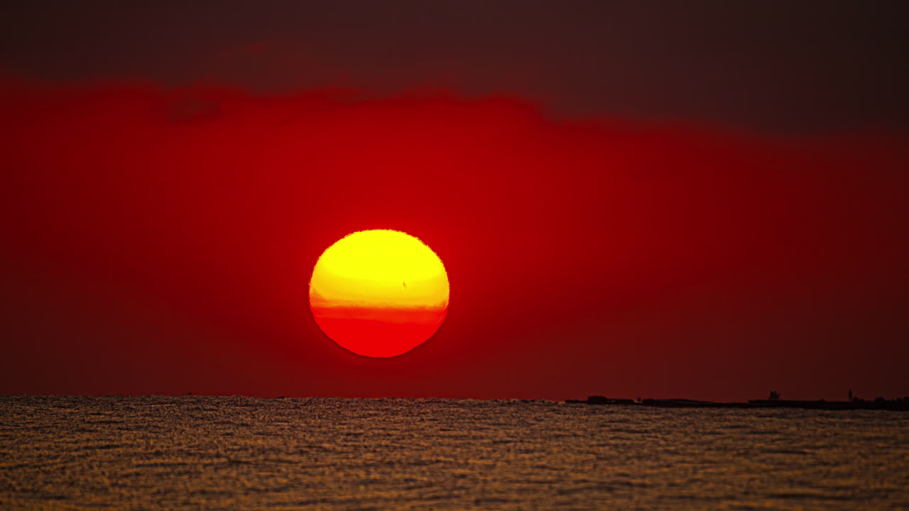 The glowing sun raising rising over the Mediterranean Sea - glorious, zoomed in, sunrise time lapse