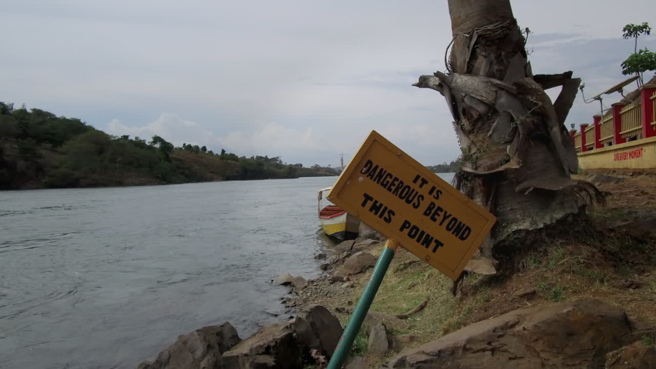 A danger sign warns tourists on the Nile River in Jinja, Uganda.