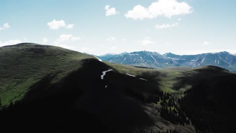 Drone-in-the-mountains,-flying-near-clouds