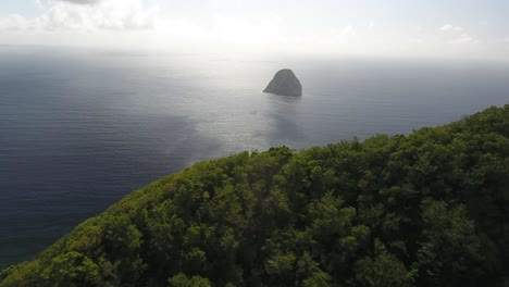 aerial drone shot over morne l'archer. zoom in to le rocher du diamant