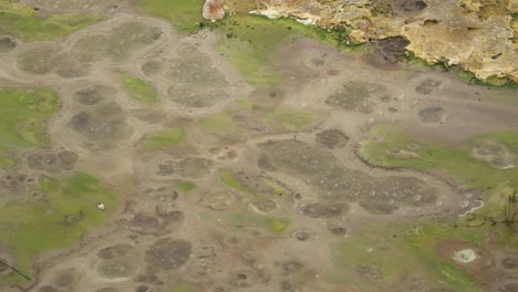 bubbles in a boiling hot geothermal volcanic mud pool at the geysers, &quot;caldeiras of furnas&quot;, san miguel island, azores - slow motion