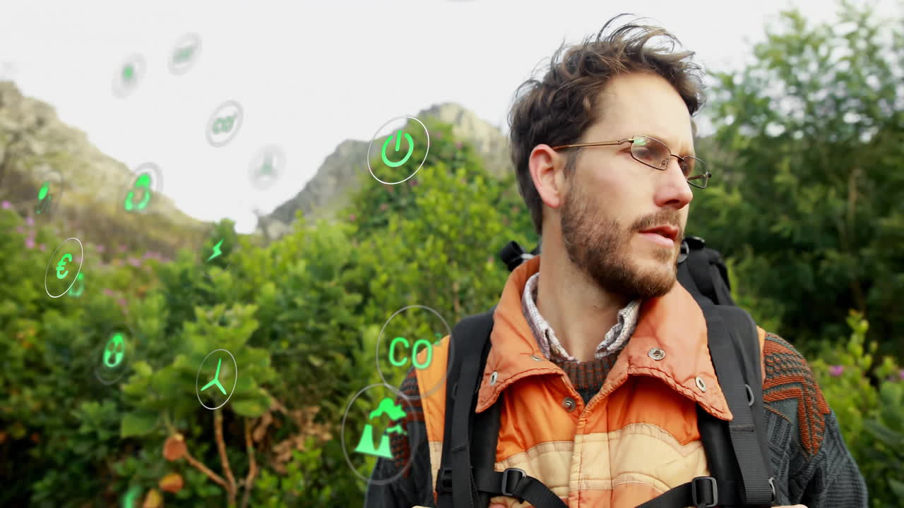 Male hiker exploring mountain trail, interacting with floating green AR energy icons for green tech