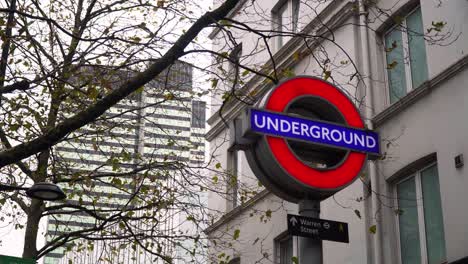 Underground-metro-sign-in-London,-United-Kingdom,-paralax-shot