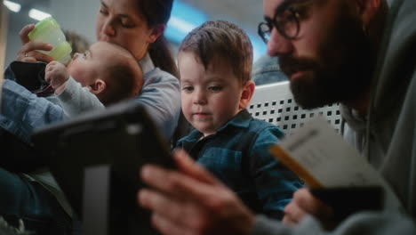 family waiting at airport