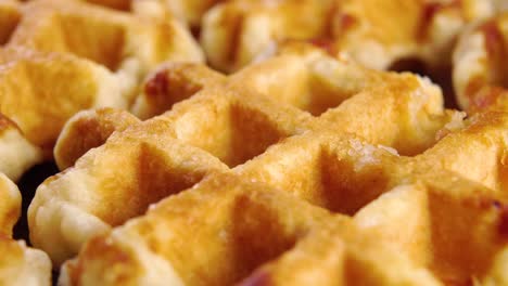 baked round belgian soft waffles. macro. liege breakfast pastry dessert