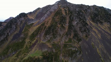 Majestic Alpine peaks surround tranquil Ilheou Lake scenery