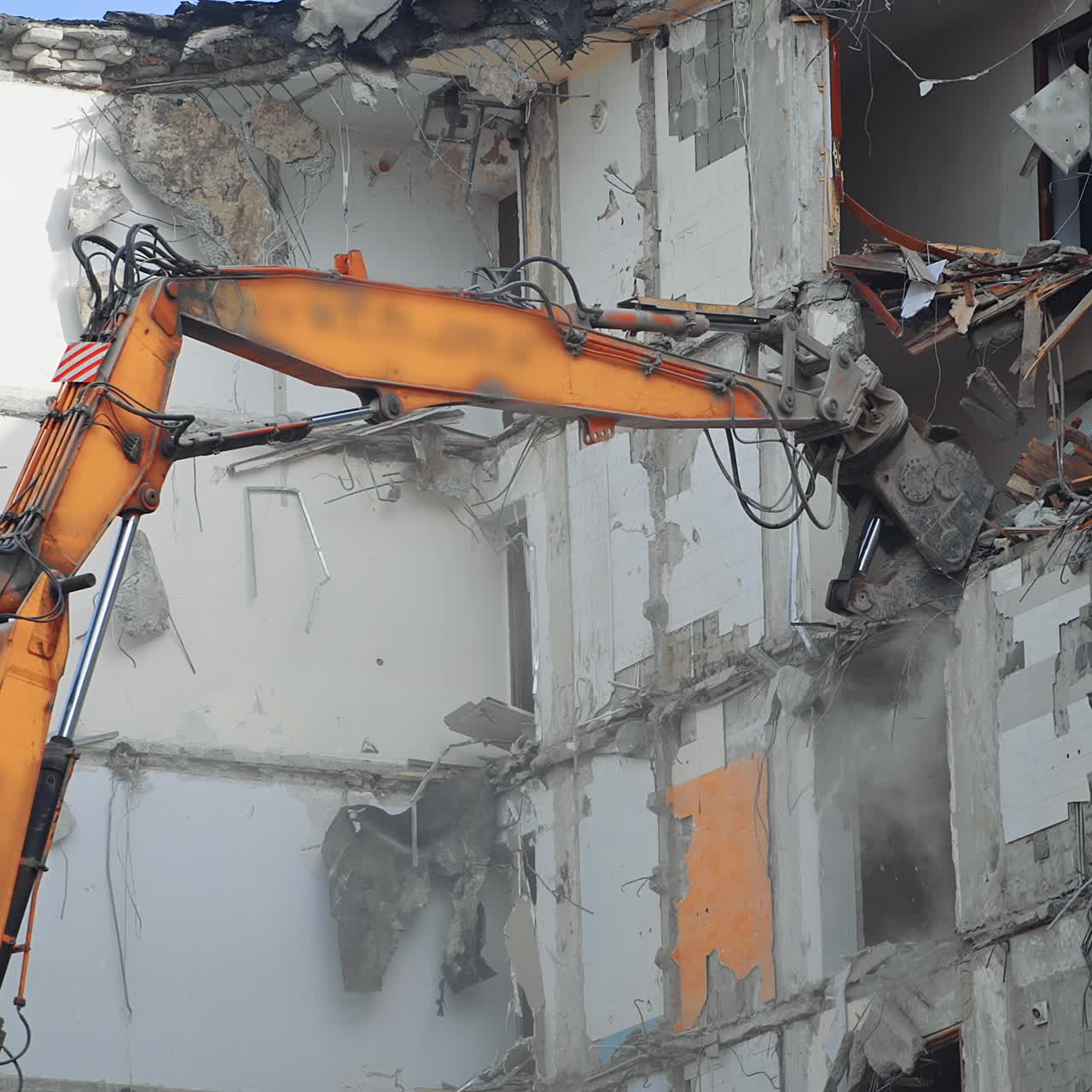 Special machine destroys the house. Demolition excavator destroys an old building