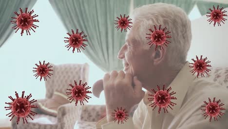 animation of virus cells over happy caucasian senior man looking into distance